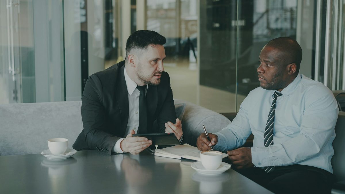Consultants reviewing operations during a diagnostic meeting